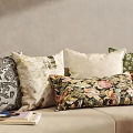 Colorful Throw Pillows With Floral And Geometric Patterns On Beige Sofa