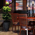 Round Wooden Dining Table With Upholstered Chairs And Decorative Candle Holders