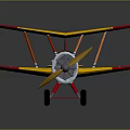 Colorful Red And Yellow Toy Biplane With Metal Propeller And Black Wheels On Dark Background