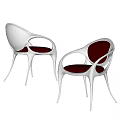 Modern Metallic Dining Chairs With Curved Design And Red Seats