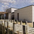 Modern Sales Office Building With Lawn Trees And Blue Sky View