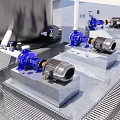 Industrial Blue Pumps Mounted On Metal Platforms With Motors And Pipes