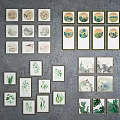 Various Framed Decorative Wall Art With Animal And Plant Designs On Gray Background