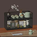 Two Tier Black Metal Shelf Holding Tea Set Teacups Teapot Tea Canisters on Wooden Table