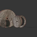 Wooden Cable Reels With Black Cables In Various Sizes On Dark Background