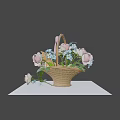 Cute Kitten Sitting In Wicker Basket With Roses Blue Flowers And Pink Bow On Table