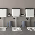 Three Modern Toilets With Water Tanks And Toilet Brushes On Gray Floor