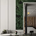 Hotel Public Lounge Featuring Green Marble Accent White Walls And Cozy Seating