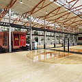 Spacious Indoor Basketball Court With Wooden Flooring And Exposed Beams