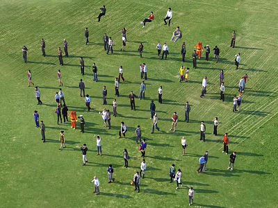 Group of People Standing in Arranged Formation on Green Grass Field 3d model