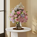 Elegant Pink Purple White Flowers with Green Leaves in Transparent Glass Vase on Table