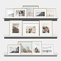 Photo Frames Display on White Shelves with Family Memories and Scenery