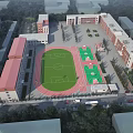 Modern School Building Complex Featuring Football Field Running Track And Green Surroundings