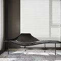 Modern Black Chaise Lounge With Curved Design In Minimalist Interior Room With Window Blinds