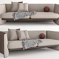 Modern Minimalist Two Seater Sofa With Beige Upholstery Checkered Blanket And Soft Pillows