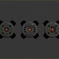 Three Round Weapon Devices Featuring Red Green Yellow Buttons And Black Stands