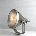Illuminated Metal Wall Lamp With Circular Lampshade And Adjustable Knob On White Brick Wall
