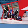 Yamaha Red And White Exhibition Booth With Truss Structure Motorcycles On Display And Reception Counter