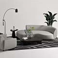Modern Gray Sofa And Black Coffee Table With Striped Rug Floor Lamp And Potted Plant