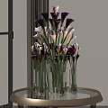 Purple and White Calla Lilies in Transparent Glass Vases on Round Glass Table with Window