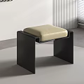 Modern Minimalist Stool With Black Frame And Beige Cushioned Seat In Interior Design