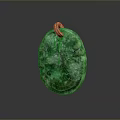 Green Carved Pendant With Intricate Design And Gold Ring For Accessories