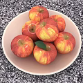 Juicy Fresh Red and Yellow Apples on a White Plate Over Speckled Countertop