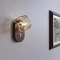 Diamond Shaped Modern Wall Sconce With Amber Glass Shade And Wooden Base On Light Wall
