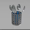 Stainless Steel Spoons In Perforated Metal Container With Blue Dots On Dark Background