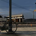 Covered Parking Lot With Bicycle Parked During Sunset And Well Lit Spacious Paved Area