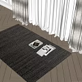 Gray Woven Square Area Rug With Magazines On Wooden Floor By Curtains In Natural Light