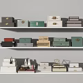 Various Colored Styled Storage Boxes On White Shelves For Home Decor