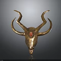 Golden Decorative Animal Skull with Curved Horns and Red Gemstone on Forehead