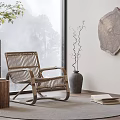 Rattan Leisure Rocking Chair In Room With Wooden Table Vase And Natural Scenery Through Window