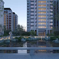 Modern Tall Residential Buildings With Landscaped Garden Water Pond And Evening Illuminated View