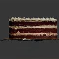 Layered Red Velvet Cake With White Frosting And Red Sprinkles On Plate