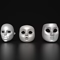Three Silver Masks With Smiling Surprised And Neutral Expressions As Household Living Items