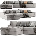 Modern Gray Sectional Sofa Featuring Plush Pillows And Cozy Blankets For Comfortable Seating 3d model