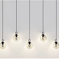 Five Modern Minimalist Pendant Lights With Spherical Glass Shades Hanging In Interior