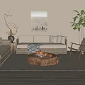 Cozy Living Room Sofa And Coffee Table Set With Beige Upholstery Round Wooden Table Woven Armchair Potted Plant And Decorative Painting