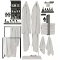 Modern Bathroom Towels Hanging And Folded On Racks With Accessories And Bottles