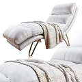 Modern White Leather Recliner with Metal Legs and Soft Knitted Blanket