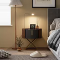 Modern Bedside Table With X Shaped Legs Gold Accents Lamp And Aromatherapy Diffuser In Bedroom