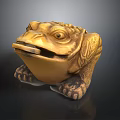 Golden Toad Statue With Intricate Carved Patterns On Black Background
