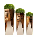 Modern Metallic Planters with Round Topiary Plants in Various Heights