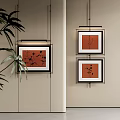 Minimalist Botanical Paintings Hanging On Beige Wall With Black Frames And Decorative Leaves