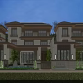 Modern Townhouse Row Exterior With Warm Evening Lighting And Landscaped Front Yard