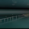 Long Bridge Over Blue Ocean Connecting Green Island With Sailboats And Clear Sky
