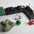 Modern Black L shaped Sofa And Glass Coffee Table With Cushions Green Cabinet And Decorative Elements