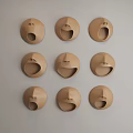 Round Brown Wall Decor with Various Facial Expression Designs for Modern Interior 3d model